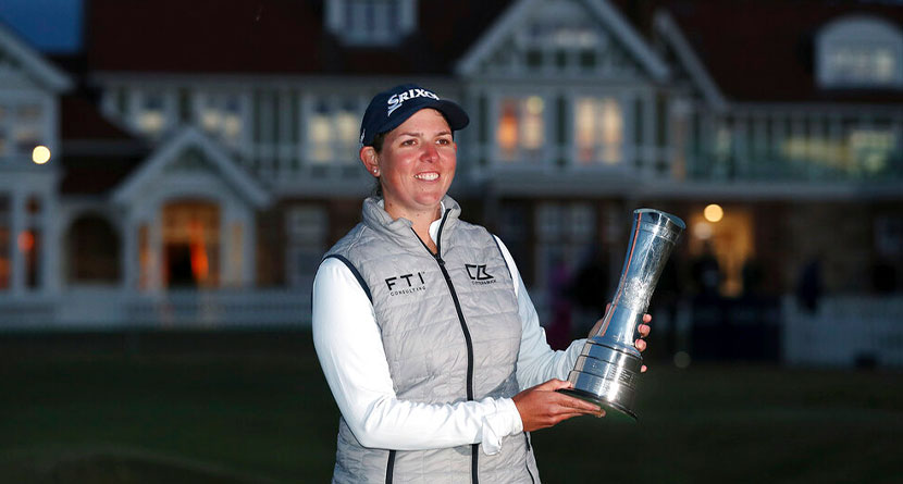 South Africa's Ashleigh Buhai poses for the media holding the trophy after winning the Women's British Open golf