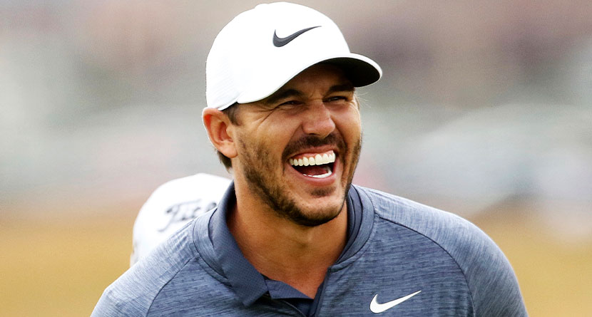 U.S. golfer Brooks Koepka laughing on the 16th green during a practice round for the 147th Open golf Championship at Carnoustie golf club, Scotland, Monday July 16, 2018. (AP Photo/Peter Morrison)
