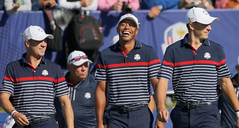 US players Justin Thomas, left, Tiger Woods and Jordan Spieth share a laugh as they walk off the 1st tee during a practice round for the 2018 Ryder Cup at Le Golf National in Saint-Quentin-en-Yvelines, outside Paris, France, Thursday, Sept. 27, 2018. The 42nd Ryder Cup will be held in France from Sept. 28-30, 2018, at the Albatros Course of Le Golf National. (AP Photo/Francois Mori)