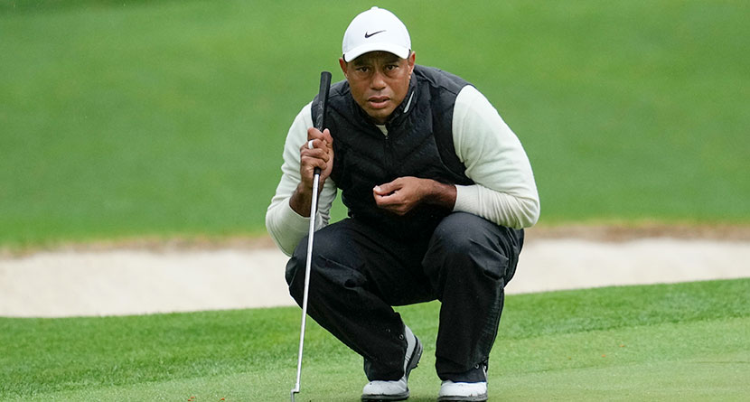 Tiger Woods lines up a putt on the 16th hole during the weather delayed second round of the Masters golf tournament at Augusta National Golf Club Saturday, April 8, 2023, in Augusta, Ga. Woods says his right ankle that was fused in April is pain-free, but other parts of his leg are not. (AP Photo/Mark Baker, File)
