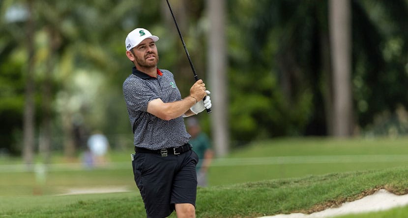 Captain Louis Oosthuizen of Stinger GC hits his shot from a bunker on the 17th hole during the quarterfinals of the LIV Golf Team Championship Miami at the Trump National Doral on Friday, October 20, 2023 in Miami, Florida. (Photo by Sam Greenwood/LIV Golf via AP)