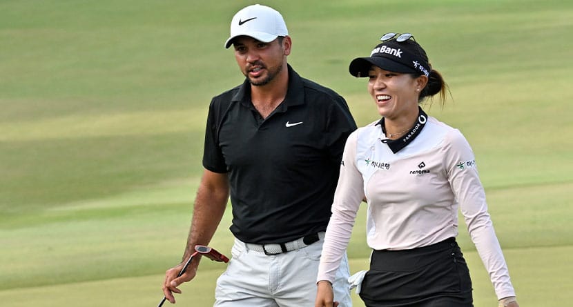 Jason Day, left, and Lydia Ko, right, walk to the 18th green during the final round of the Grant Thornton Invitational, the first mixed-team golf tournament since 1999, Sunday, Dec. 10, 2023, in Naples, Fla. Ko and Day won the tournament. (AP Photo/Steve Nesius)