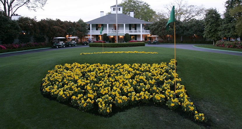 This April 5, 2006 file photo shows bright yellow flowers in the shape of the United States adorn the lawn at the clubhouse during practice for the 2006 Masters golf tournament at the Augusta National Golf Club in Augusta, Ga.