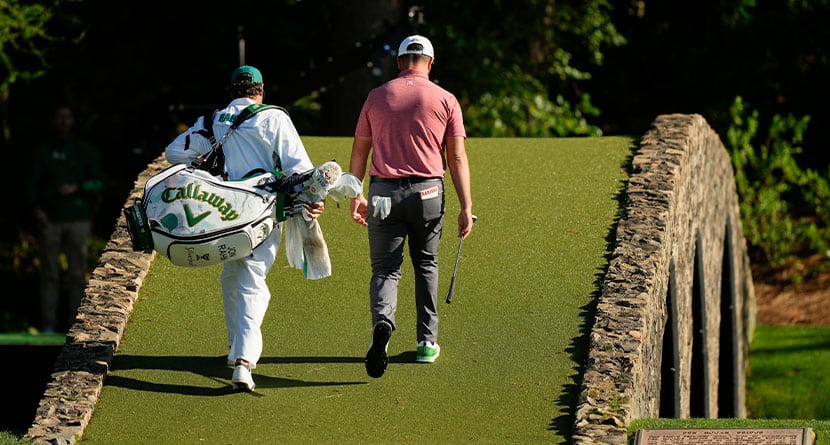 Jon Rahm, of Spain, walks over the bridge on the 12th hole during the final round of the Masters golf tournament at Augusta National Golf Club on Sunday, April 9, 2023, in Augusta, Ga. Rahm said his 9-iron to the middle of the 12th green was one shot he'll remember. (AP Photo/Charlie Riedel, File)
