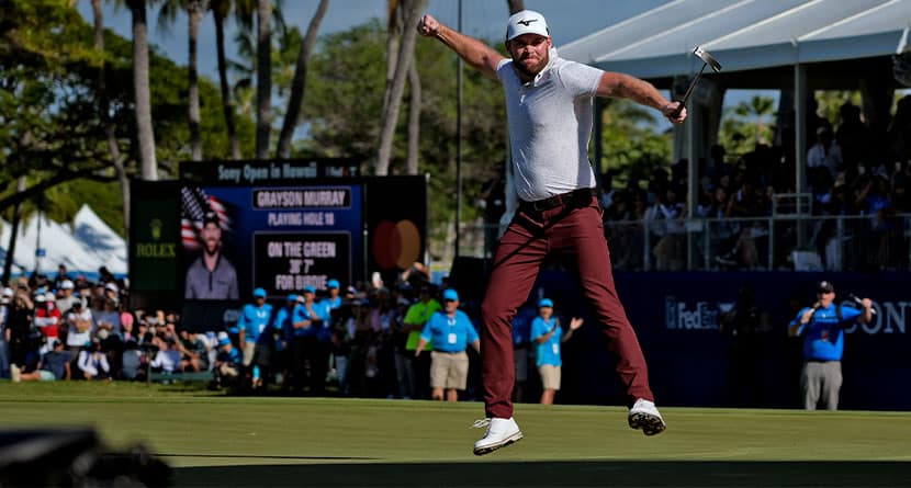 Grayson Murray celebrates winning the Sony Open golf event, Sunday, Jan. 14, 2024, at Waialae Country Club in Honolulu. (AP Photo/Matt York)