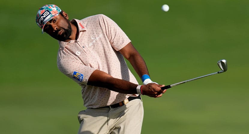 Sahith Theegala hits his approach shot form the 18th fairway during the first round of The Sentry golf event, Thursday, Jan. 4, 2024, at Kapalua Plantation Course in Kapalua, Hawaii. (AP Photo/Matt York)