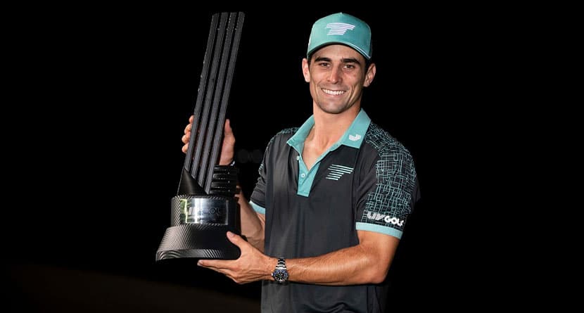 Captain Joaquín Niemann, of Torque GC, first place individual champion, celebrates with the trophy after winning in a four-hole playoff during the final round of LIV Golf Mayakoba at El Camaleón Golf Course, Sunday, Feb. 4, 2024, in Playa del Carmen, Mexico. (Montana Pritchard/LIV Golf via AP)