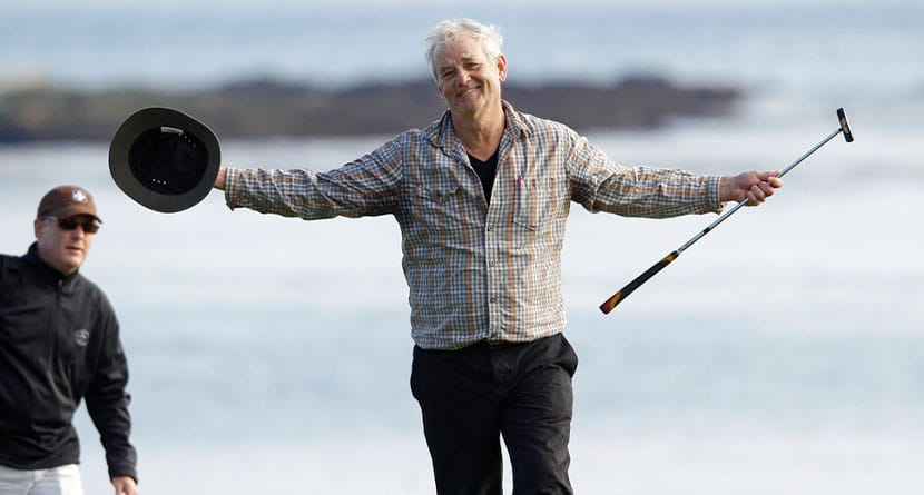 Actor Bill Murray opens his arms to the crowd while walking up the 18th green during the final round of the AT&T Pebble Beach National Pro-Am golf tournament in Pebble Beach, Calif., Sunday, Feb. 13, 2011. Murray and partner D.A. Points won the amateur portion of the championship. (AP Photo/Eric Risberg)