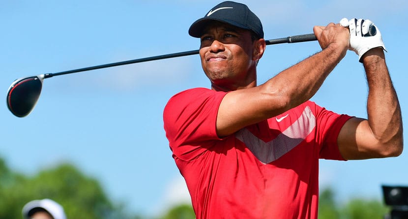 Tiger Woods follows his ball at the fourth tee during the last round of the Hero World Challenge at Albany Golf Club in Nassau, Bahamas, on Dec. 7, 2019. Woods is starting a new year with a new look. Just not a different color. Woods makes his 2024 debut this week in the Genesis Invitational at Riviera, a signature event on the PGA Tour in which he is the tournament host. The first order of business is unveiling what he referred to in December as the next “chapter.” (AP Photo/Dante Carrer, File)