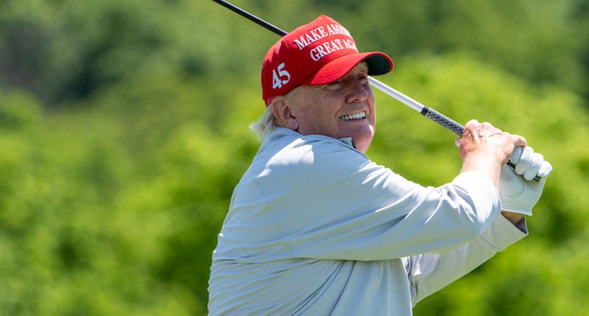 Former President Donald Trump watches his shot from the 14th tee as he plays during the LIV Golf Pro-Am at Trump National Golf Club, Thursday, May 25, 2023, in Sterling, Va. (AP Photo/Alex Brandon)