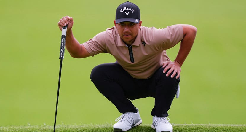 Xander Schauffele lines up a putt on the ninth green during the final round of the Genesis Invitational golf tournament at Riviera Country Club, Sunday, Feb. 18, 2024, in the Pacific Palisades area of, Los Angeles. (AP Photo/Ryan Sun)