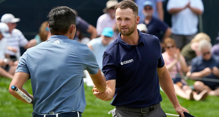 Wyndham Clark, right, shakes hands with Collin Morikawa after finishing their round during the second round of The Players Championship golf tournament Friday, March 15, 2024, in Ponte Vedra Beach, Fla. (AP Photo/Lynne Sladky)