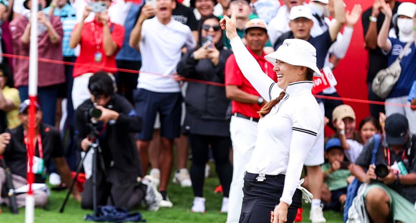 Hannah Green of Australia celebrates after scoring a putt on the 18th hole during the final round of the HSBC Women's Wold Championship at the Sentosa Golf Club in Singapore Sunday, March 3, 2024. (AP Photo/Danial Hakim)