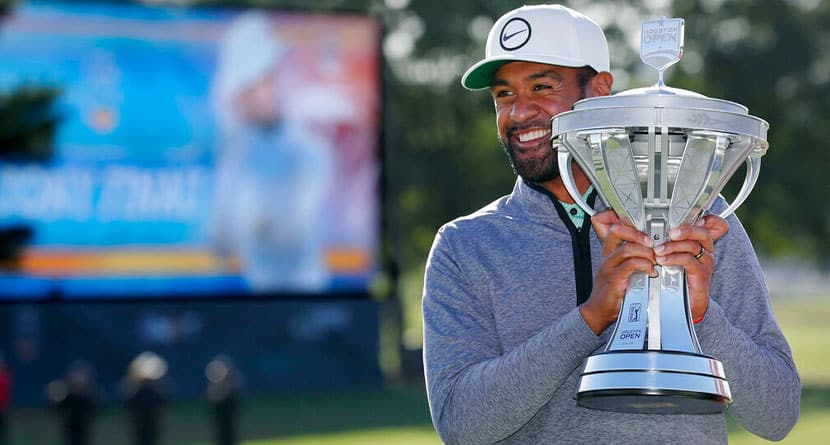 Tony Finau holds up the trophy at the end of the final round after winning the Houston Open golf tournament Sunday, Nov. 13, 2022, in Houston. (AP Photo/Michael Wyke)