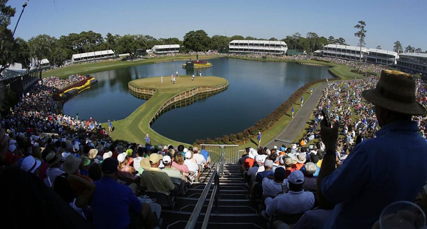 Spectators watch the action on the 17th green during the third round of The Players Championship golf tournament Saturday, May 14, 2016, in Ponte Vedra Beach, Fla. (AP Photo/Chris O'Meara)