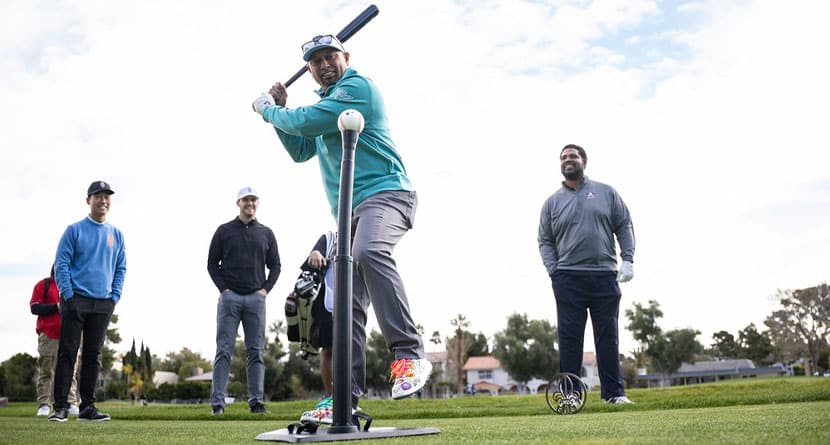 Amateur Shane Victorino hits a baseball on the course as Captain Kevin Na of Iron Heads GC, Amateur Derek Carr and Amateur Jonathan Ogden look on during the pro-am before the start of the LIV Golf Las Vegas at the Las Vegas Country Club on Wednesday, February 07, 2024 in Las Vegas, United States. (Photo by Scott Taetsch/LIV Golf via AP)