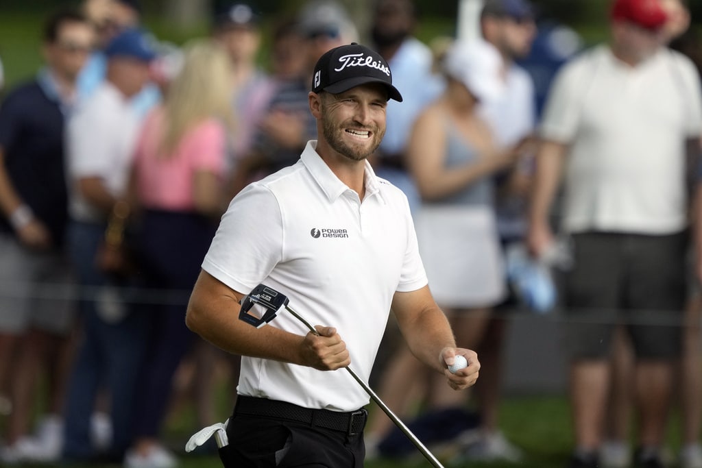 Wyndham Clark smiles as he walks off the second green during the third round of The Players Championship golf tournament Saturday, March 16, 2024, in Ponte Vedra Beach, Fla. (AP Photo/Lynne Sladky)
