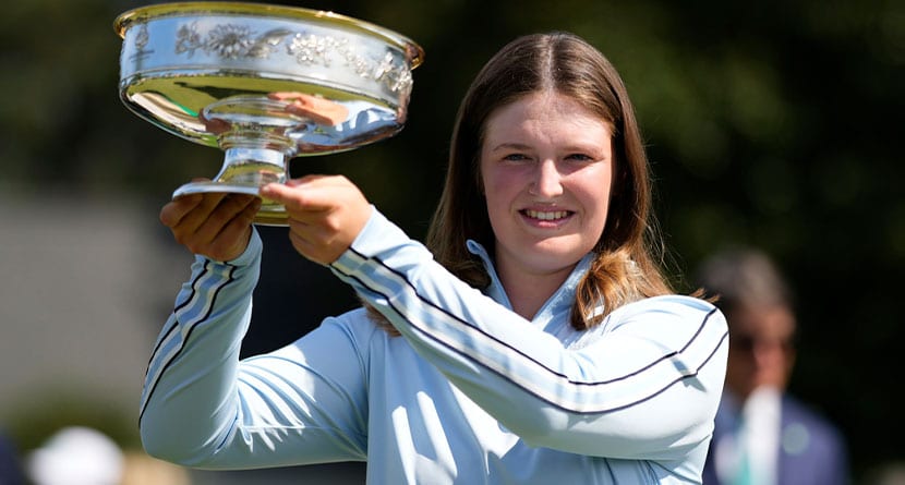 Lottie Woad, of England, poses with the trophy after winning the Augusta National Women's Amateur golf tournament, Saturday, April 6, 2024, in Augusta, Ga. (AP Photo/Matt Slocum)
