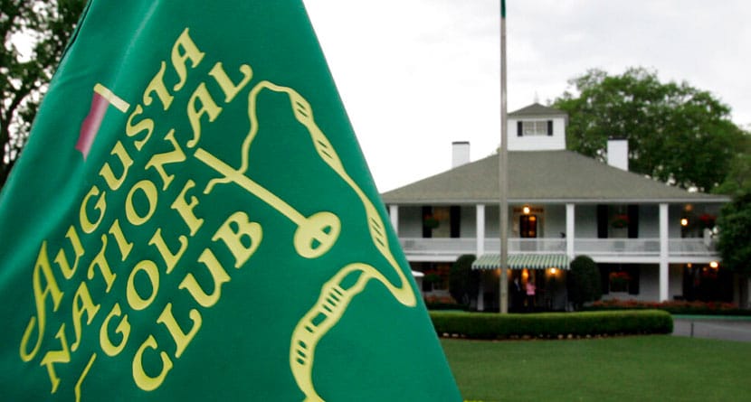 In this April 4, 2007, file photo, cloudy skies appear above the clubhouse at the Augusta National Golf Club in Augusta, Ga. Several members of a Texas family have been charged with federal crimes in what prosecutors say was a scheme that used stolen identities to get tickets to the Masters golf tournament, then resell those tickets at a healthy profit. (AP Photo/David J. Phillip, File)