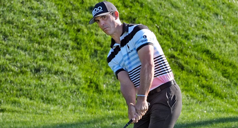 Billy Horschel chips from the rough along the second green during the first round of The Players Championship golf tournament Thursday, March 14, 2024, in Ponte Vedra Beach, Fla. (AP Photo/Marta Lavandier)
