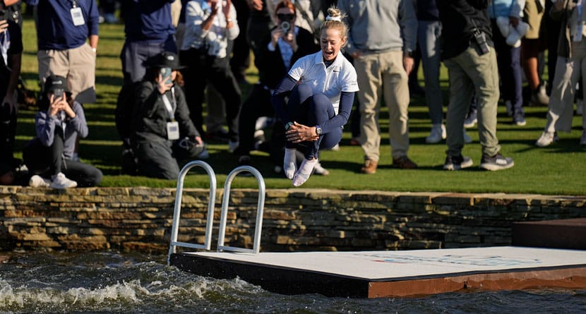 Nelly Korda jumps into the lake after winning the Chevron Championship LPGA golf tournament Sunday, April 21, 2024, at The Club at Carlton Woods in The Woodlands, Texas. (AP Photo/Eric Gay)