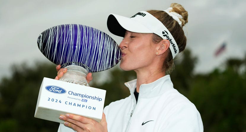 Nelly Korda kisses the trophy as she poses for photographs after winning the LPGA Ford Championship golf tournament Sunday, March 31, 2024, in Gilbert, Ariz. (AP Photo/Ross D. Franklin)