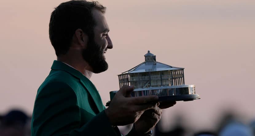 Scottie Scheffler holds the trophy after winning the Masters golf tournament at Augusta National Golf Club Sunday, April 14, 2024, in Augusta, Ga. (AP Photo/Charlie Riedel)