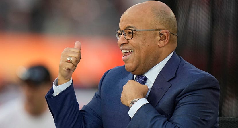 NBC broadcaster Mike Tirico motions to fans before the NFL Super Bowl 56 football game between the Los Angeles Rams and the Cincinnati Bengals, Sunday, Feb. 13, 2022, in Inglewood, Calif. Tirico and Dan Hicks will be sharing play-by-play duties at the U.S. Open golf championship this year. (AP Photo/Lynne Sladky, File)