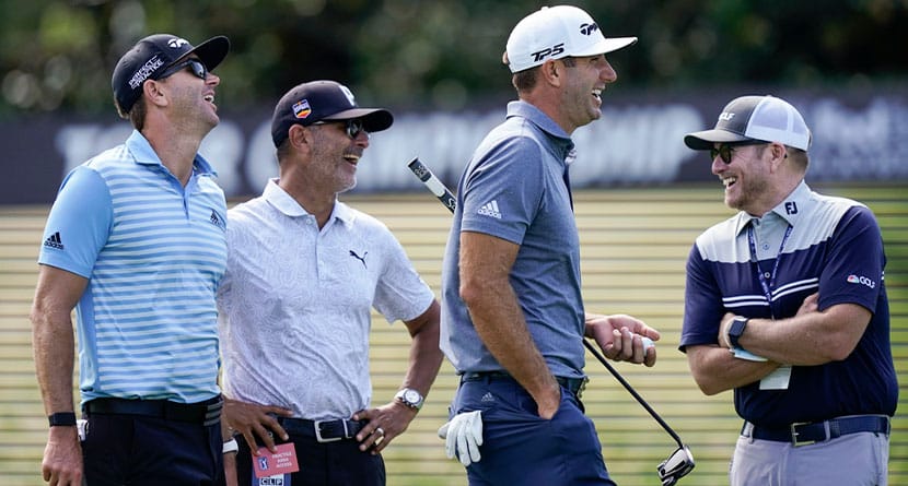 NBC on-course reporter John Wood, right, Dustin Johnson, second from right, Claude Harman, second from left and caddie Austin Johnson share a laugh during practice for the Tour Championship on Sept. 1, 2021, at East Lake Golf Club in Atlanta. Wood, a former caddie, has been appointed Ryder Cup team manager for the Americans.(AP Photo/Brynn Anderson, File)