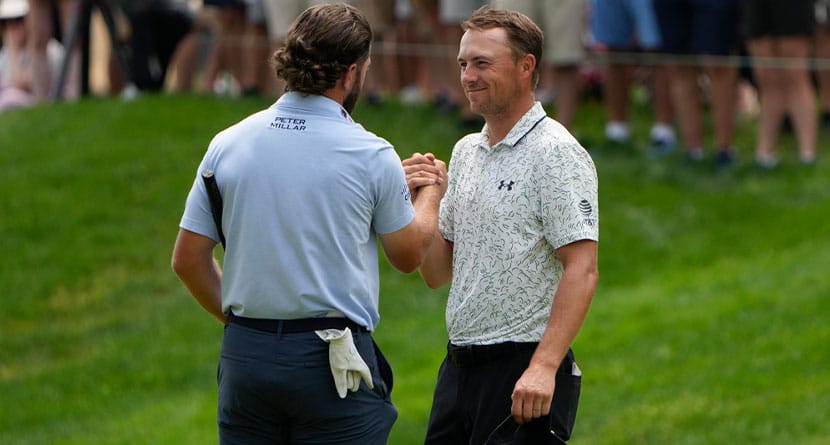 Cameron Young, left, celebrates with Jordan Spieth on the 18th green after they finished their round during the third round of the Travelers Championship golf tournament at TPC River Highlands, Saturday, June 22, 2024, in Cromwell, Conn. (AP Photo/Seth Wenig)