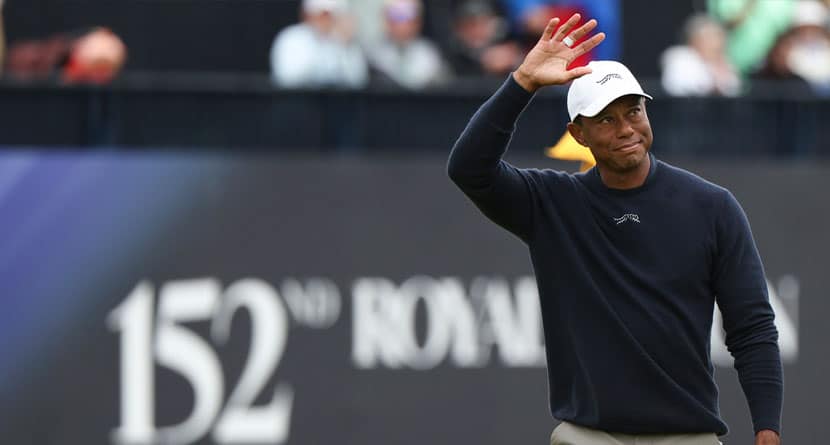 Tiger Woods of the United States waves as he walks off the 18th green following his second round of the British Open Golf Championships at Royal Troon golf club in Troon, Scotland, Friday, July 19, 2024. (AP Photo/Scott Heppell)