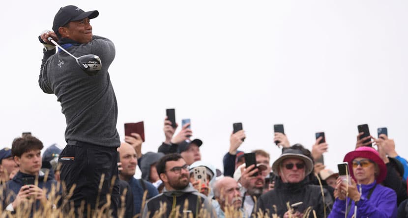 Tiger Woods of the United States hits off the fourth tee during his opening round of the British Open Golf Championships at Royal Troon golf club in Troon, Scotland, Thursday, July 18, 2024. (AP Photo/Peter Morrison)