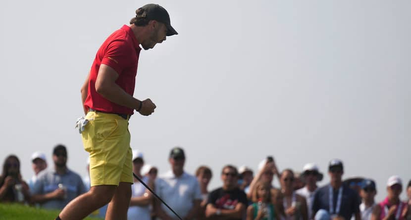 Jose Luis Ballester reacts after his shot for the 15th hole in Chaska, Minn., Sunday, Aug. 18, 2024, during the championship match against Noah Kent in the U.S. Amateur golf tournament. (Richard Tsong-Taatarii/Star Tribune via AP)