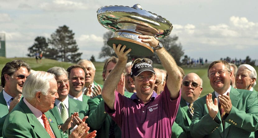 Jack Vickers, left, and other committee members look on as Australia's Rob Pampling holds the trophy after winning the International at Castle Pines in Castle Rock, Colo., Sunday, Aug. 8, 2004. (AP Photo/Jack Dempsey, File)