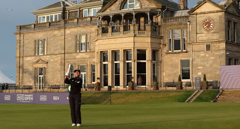 Lydia Ko, of New Zealand, holds up the trophy as Champion golfer in front of the Club house after winning the Women's British Open golf championship, in St. Andrews, Scotland, Sunday, Aug. 25, 2024. (AP Photo/Scott Heppell)