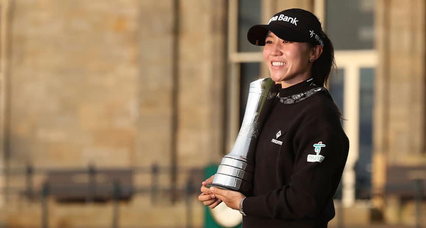 Lydia Ko of New Zealand, poses for the media with the trophy after winning the Women's British Open golf championship, and becoming Champion golfer, in St. Andrews, Scotland, Sunday, Aug. 25, 2024. (AP Photo/Scott Heppell)