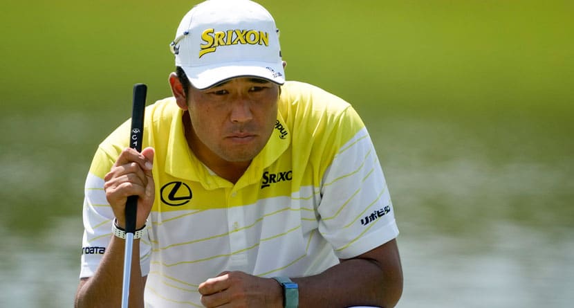 Hideki Matsuyama, of Japan, lines up a putt on the ninth green during the final round of the St. Jude Championship golf tournament Sunday, Aug. 18, 2024, in Memphis, Tenn. (AP Photo/Mark Humphrey)