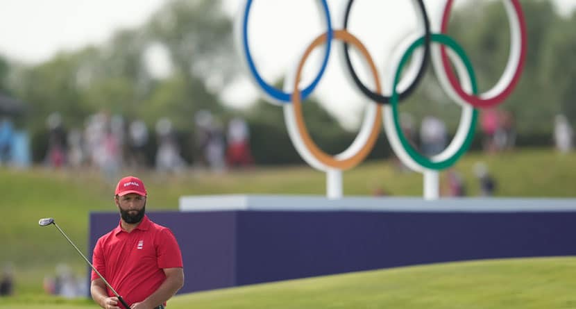 Jon Rahm, of Spain, watches his putt on the 18th green during the final round of the men's golf at the 2024 Summer Olympics, Sunday, Aug. 4, 2024, at Le Golf National in Saint-Quentin-en-Yvelines, France. Scottie Scheffler, of the United States, wins the gold medal with Tommy Fleetwood, of Britain, silver and Hideki Matsuyama, of Japan, the bronze. (AP Photo/Matt York)