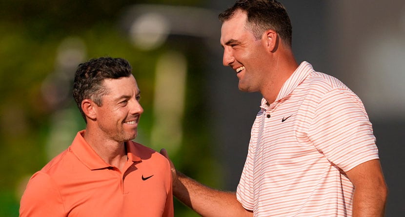 Rory McIlroy, of Northern Ireland, and Scottie Scheffler finish their first round of the U.S. Open golf tournament Thursday, June 13, 2024, in Pinehurst, N.C. (AP Photo/Mike Stewart)