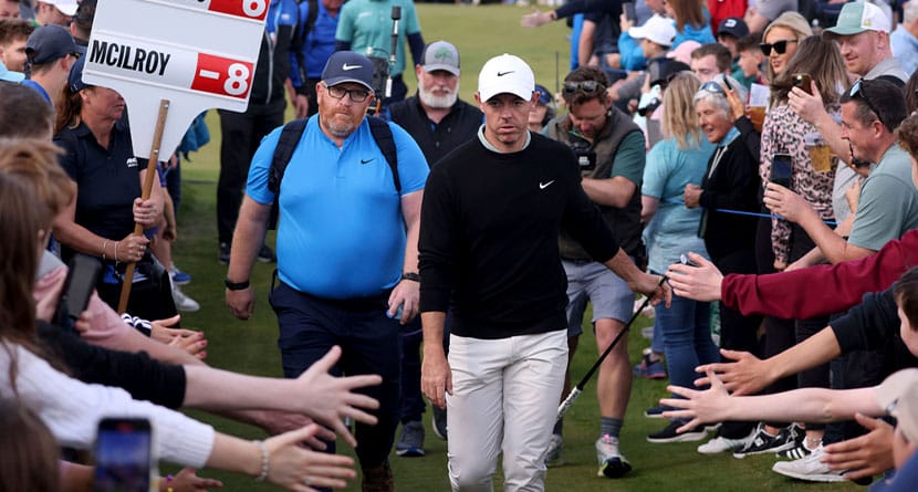 Northern Ireland's Rory McIlroy walks between lines of fans as he makes his way to the thirteenth tee during day four of the Amgen Irish Open 2024 at Royal County Down in Newcastle, County Down, England, Sunday Sept. 15, 2024. (Peter Morrison/PA via AP)