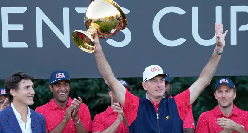 United States team captain Jim Furyk hoist the Presidents Cup as Canada Prime Minister Justin Trudeau looks on at Royal Montreal Golf Club on Sunday, Sept. 29, 2024, in Montreal. (Frank Gunn/The Canadian Press via AP)