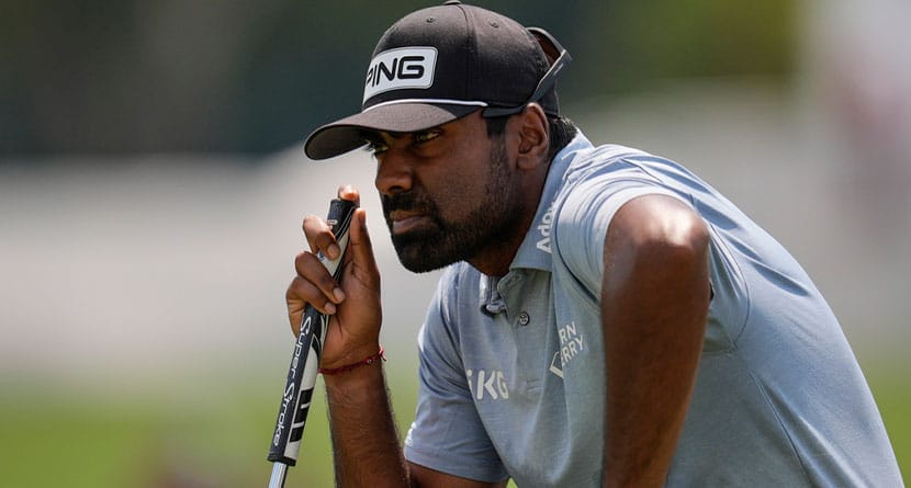 Sahith Theegala lines up his putt on the third green during the final round of the Tour Championship golf tournament, Sunday, Sept. 1, 2024, in Atlanta. (AP Photo/Mike Stewart)