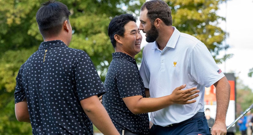 United States team members Scottie Scheffler, right, is congratulated by International Team member Tom Kim, center, and Sungjae Im, left, of South Korea, as they concede their first-round four-ball match at the Presidents Cup golf tournament at the Royal Montreal Golf Club in Montreal, Thursday, Sept. 26, 2024. (Frank Gunn/The Canadian Press via AP)