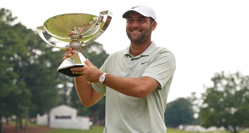 Scottie Scheffler poses with the FedExCup Trophy after the final round of the Tour Championship golf tournament, Sunday, Sept. 1, 2024, in Atlanta. (AP Photo/Jason Allen)