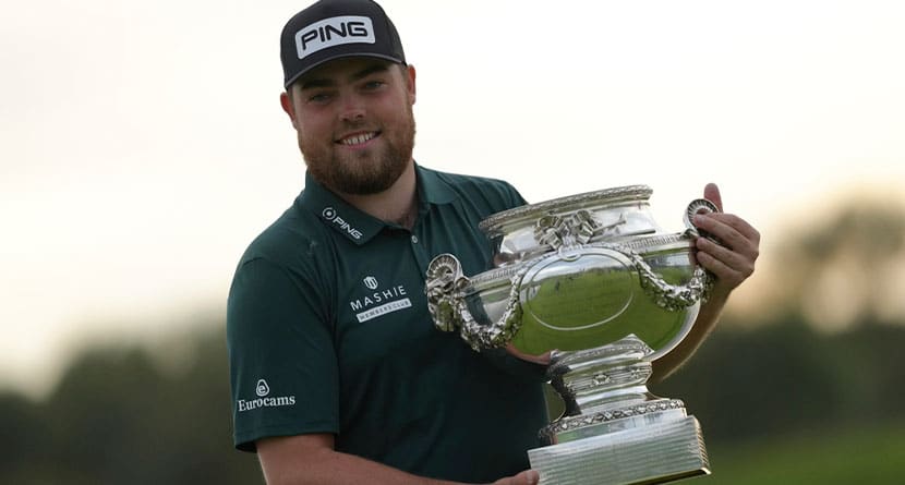 Dan Bradbury of England poses for photographers with the trophy after winning the Golf French Open at Le Golf National in Saint-Quentin-en-Yvelines, outside Paris, France, Sunday, Oct. 13, 2024. (AP Photo/Thibault Camus)