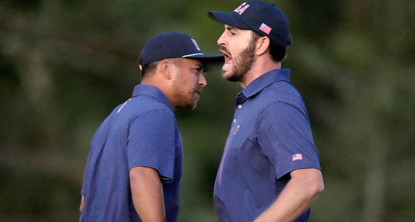 United States team member Patrick Cantlay, right, celebrates with partner Xander Schauffele, left, after winning their fourth-round foursomes match at the Presidents Cup golf tournament at Royal Montreal Golf Club in Montreal, Saturday, Sept. 28, 2024. (Frank Gunn/The Canadian Press via AP)