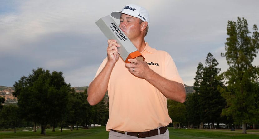 Patton Kizzire kisses the trophy after winning the Procore Championship golf tournament at Silverado Resort North Course, Sunday, Sept. 15, 2024, in Napa, Calif. (AP Photo/Godofredo A. Vásquez)