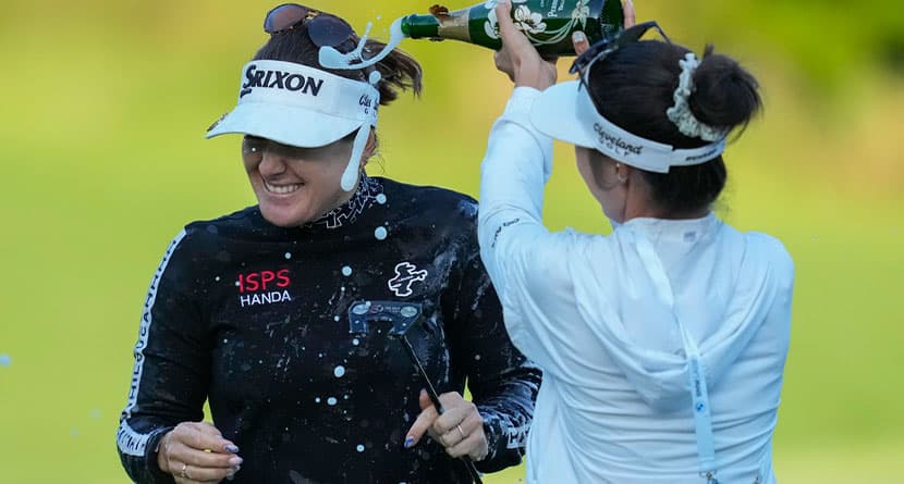 Hannah Green of Australia , left, celebrates after winning the LPGA Ladies Championship golf tournament at the Seowon Valley Country Club in Paju, South Korea, Sunday, Oct. 20, 2024. (AP Photo/Lee Jin-man)