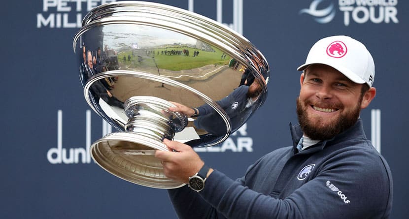 Tyrrell Hatton celebrates with the trophy after winning the Alfred Dunhill Links Championship, at the Old Course St. Andrews, Britain, Sunday Oct. 6, 2024. (Robert Perry/PA via AP)