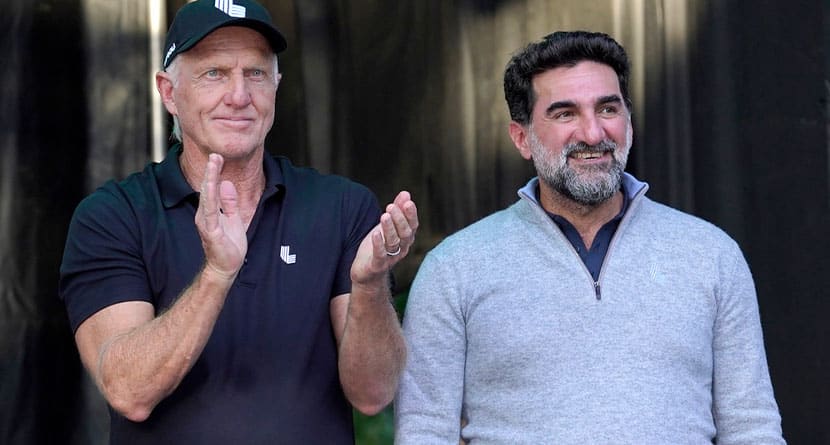 LIV Golf CEO Greg Norman, left, applauds Yasir Al-Rumayyan, Governor of Public Investment Fund of Saudi Arabia, at the LIV Golf Invitational-Chicago tournament Sept. 18, 2022, in Sugar Hill, Ill. (AP Photo/Charles Rex Arbogast, File)